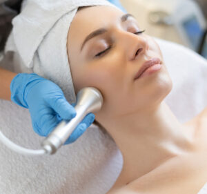 young-woman-lying-cosmetologist-s-table-rejuvenation-procedure-cosmetologist-take-care-abo