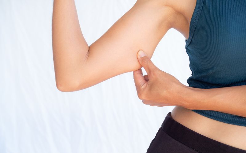 Arms: Tighten "bingo wings" (triceps)